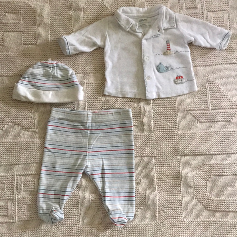 Newborn Cardigan, footed pants, and baby hat.
